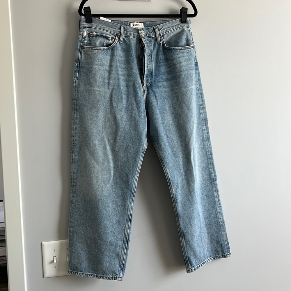 Unworn Agolde boyfriend cut jeans. No tags. Button fly. Light wash.